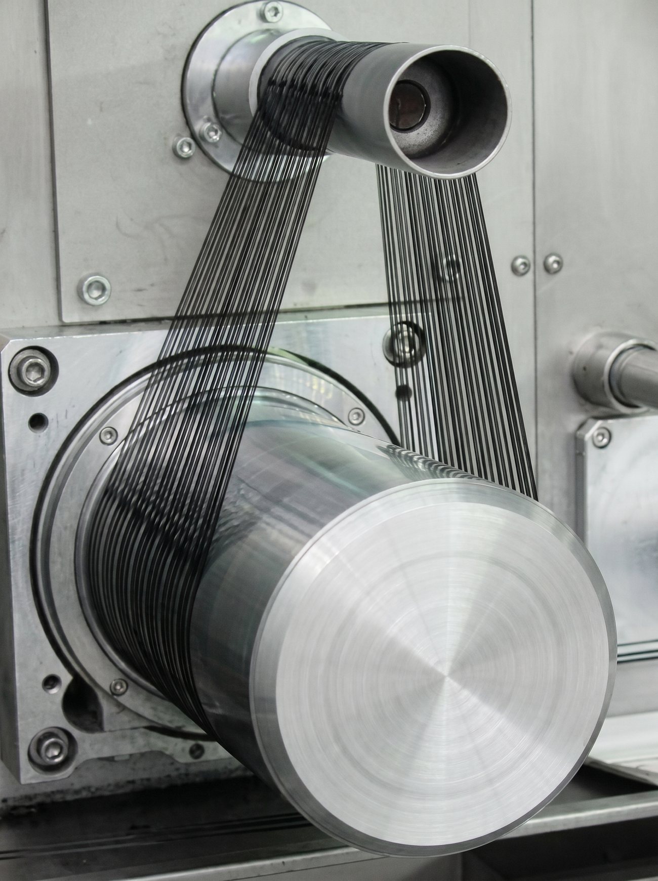 Polypropylene filaments running over a polished godet on the extrusion line