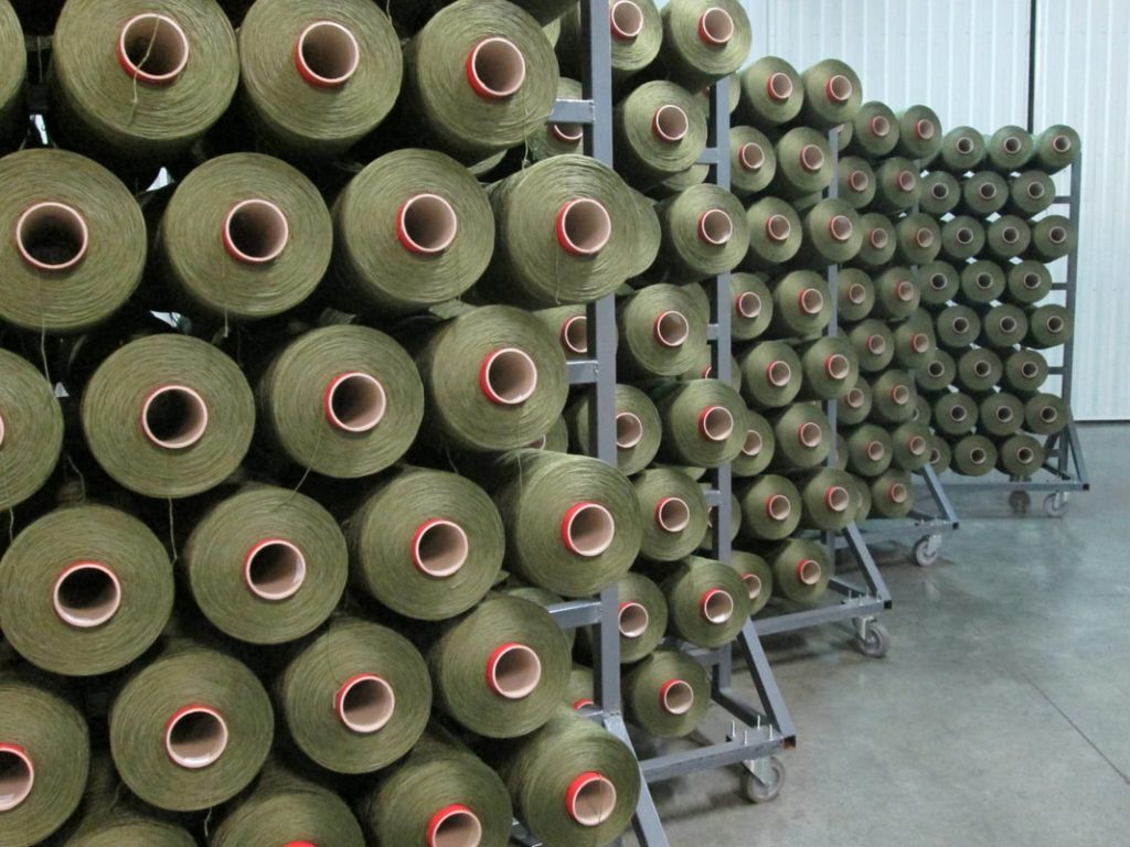 Green polypropylene yarn cones at the Euro Yarns plant